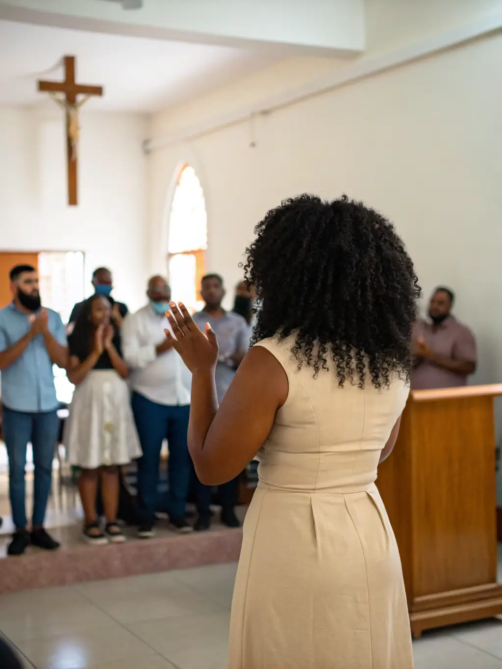 A group of Renewal Church members praying together during a weekly prayer meeting, seeking God's guidance and intervention for the church and community.